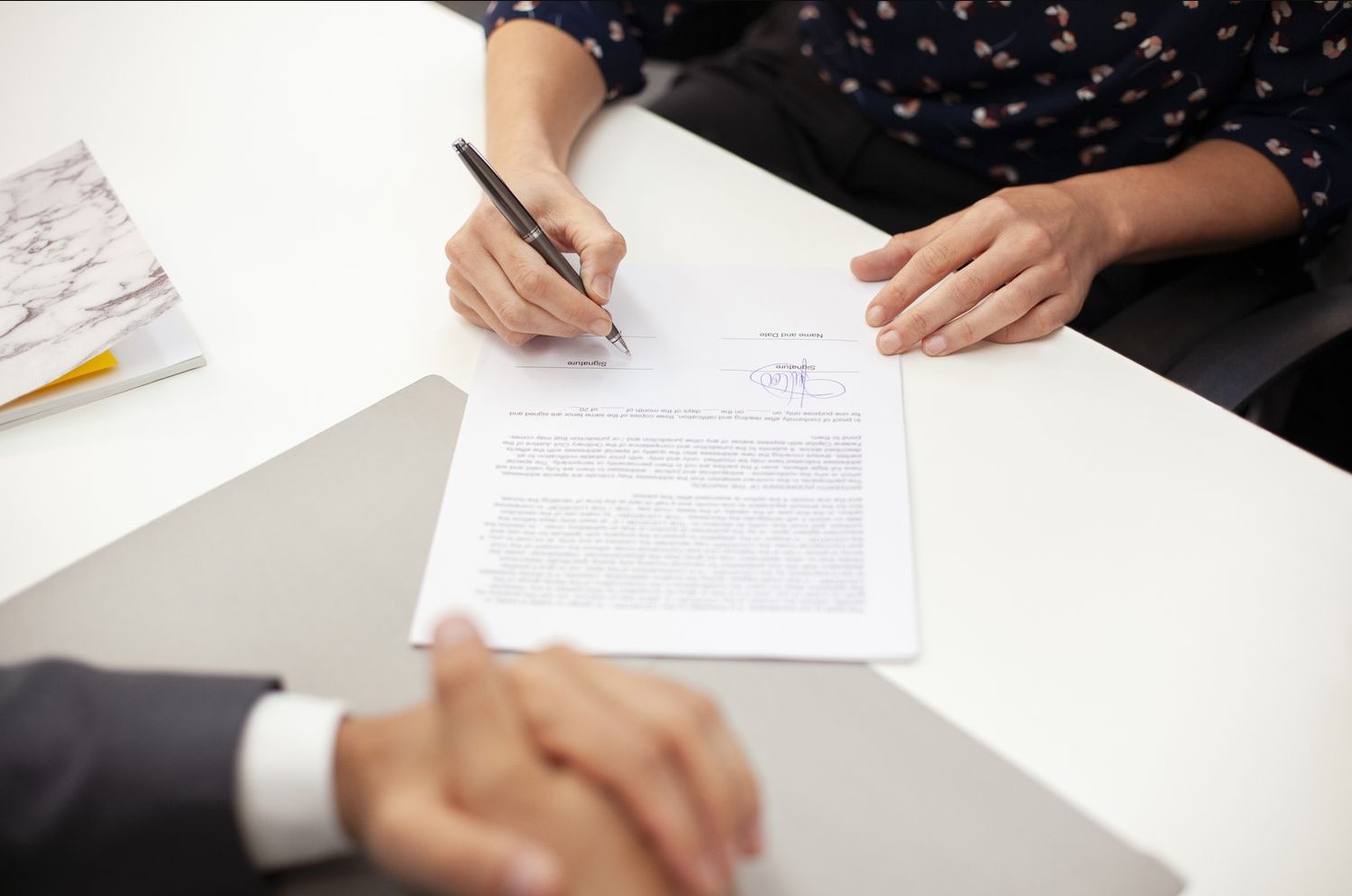 business agreement being notarized for two soon to be business partners in palm coast, fl