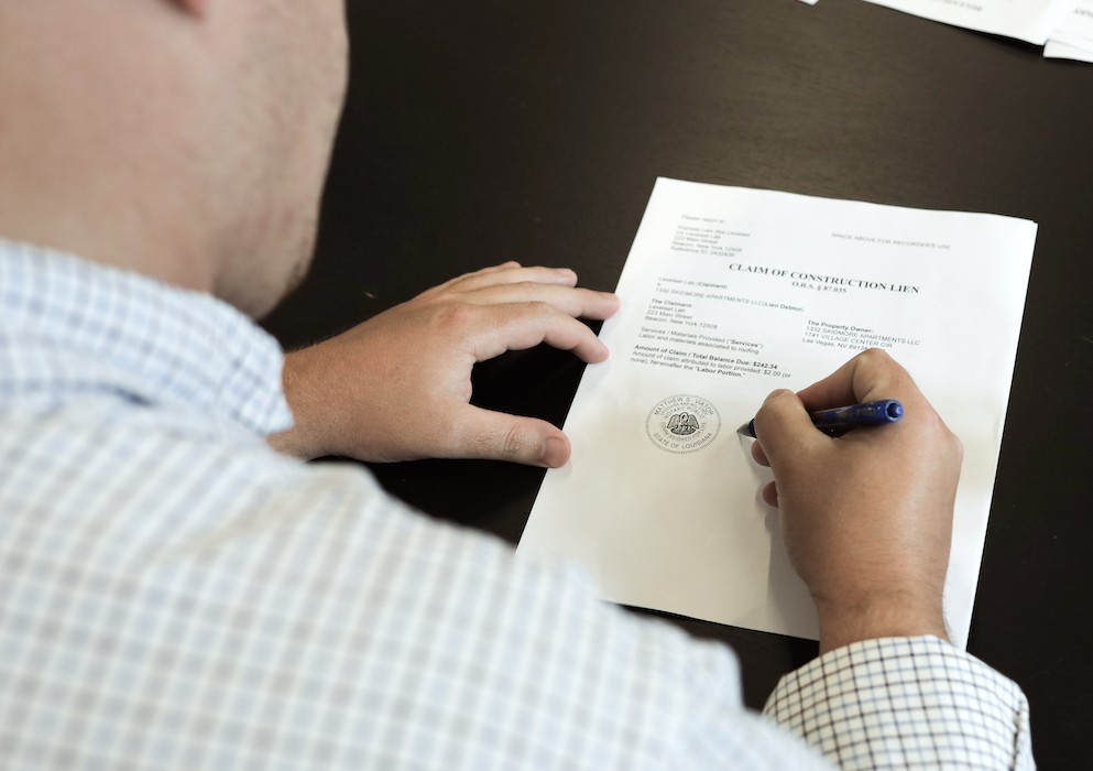 signing & notarizing a construction contract to build a new home in Palm Coast, FL